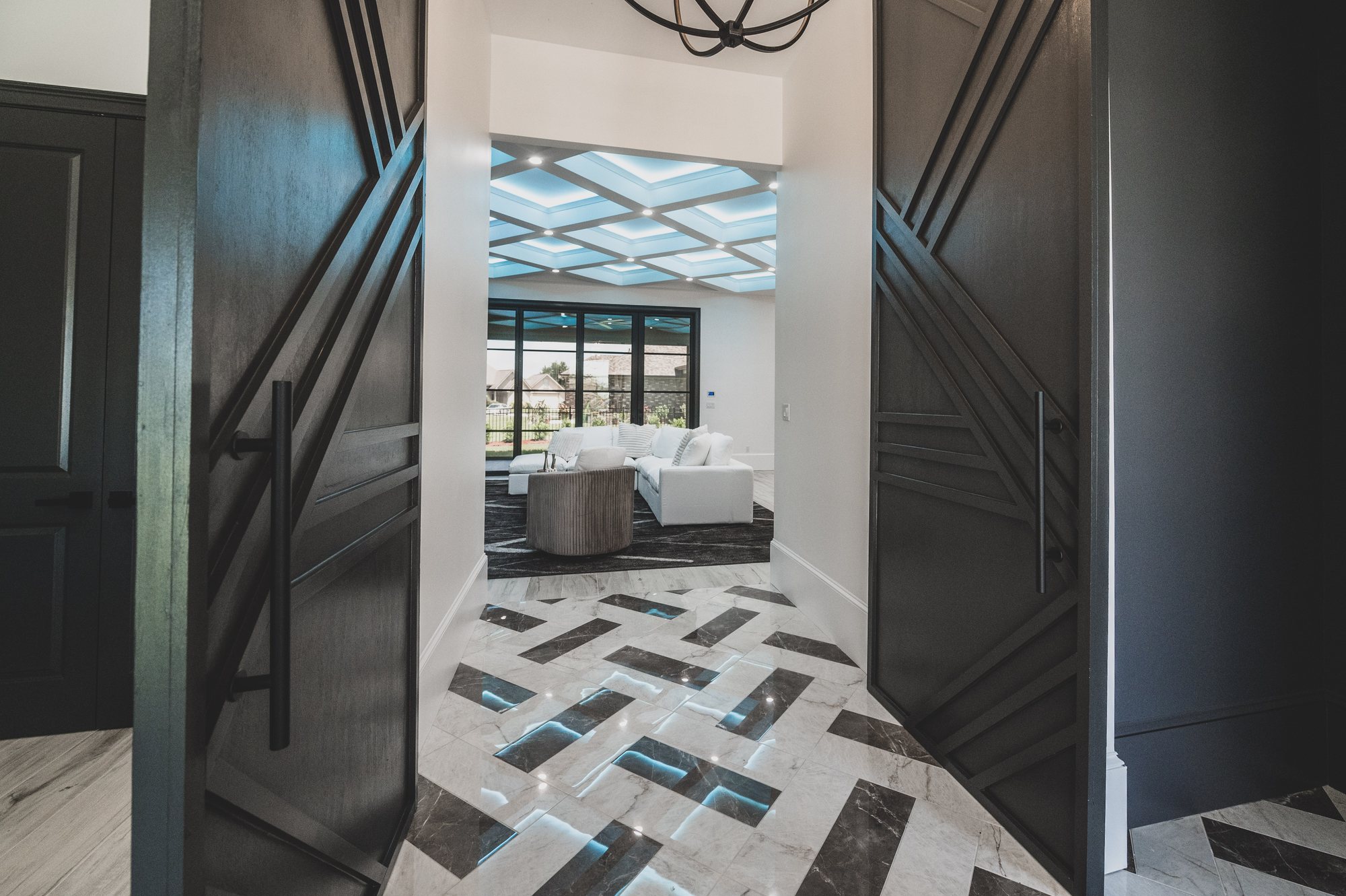 Geometric double doors into the living room at 105 Lac Lafreniere Court