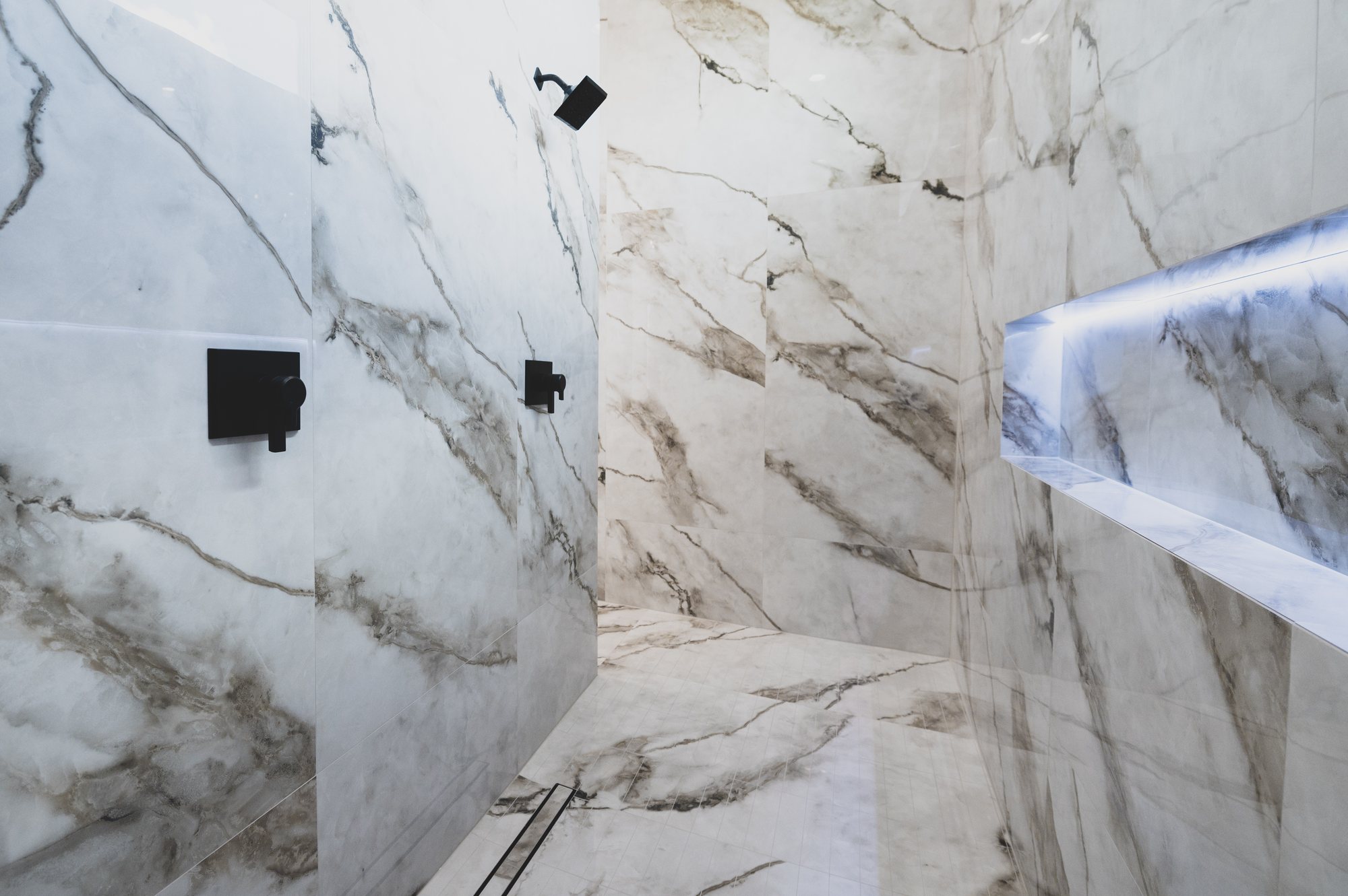Marble walk-in shower at 105 Lac Lafreniere Court